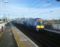 Diesel on the North Berwick line? A category mistake caused by work on the OLE, I imagine, as there were no electrics running. An afternoon service to Edinburgh calls in low sunlight from the southwest. Notice that a frost is expected.<br><br>[David Panton 21/11/2015]