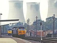 A striking photograph of 50006 <I>Neptune</I> at Didcot on the 9th of October 1982, using a telephoto lens drawing the cooling towers into the picture. These towers have since been demolished as the coal fired power station was life expired and the former D406 was withdrawn in 1987 and later scrapped. <br><br>[Peter Todd 09/10/1982]