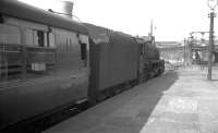 BR Standard class 5 4-6-0 73153 awaiting departure time at Glasgow Buchanan Street in the summer of 1966.<br><br>[K A Gray //1966]