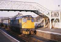 27018 bound for Waverley calls at Inverkeithing at 1426 hours on 29 October 1982. The station building seen here still stands but the footbridge has been replaced by a newer model further north with ramps.<br><br>[Peter Todd 28/10/1982]