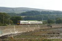 Glasgow bound 334034 heads east from Craigendoran Jct along the edge of the River Clyde on 23 September 2012.<br><br>[John McIntyre 23/09/2012]