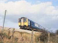 Prototype 4 car DEMU 210-001 westbound at Crofton pumping station on the Berks and Hants line on 10th November 1982. Similarities to EMUs produced in the same era can be seen in the design but the above floor MTU 1140hp engine and equipment took up half the length of the (63 tonne) power car. A second (3 car) train 210-002 had a Paxman engine. Eventually the trains were deemed too expensive and did not proceed to production. After running on the Western Region for several years the sets were disbanded although some trailer cars were reused in EMUs. [See image 32734] <br><br>[Peter Todd 10/11/1982]