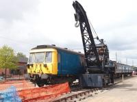 Following withdrawal in 1990 EMU 311103 was converted at Shields depot for use as a Sandite unit on the Ayr line, suitably modified with Sandite tanks fitted within the driving trailer. It was later reclassified as class 936 and renumbered in the departmental series as 936103. Following replacement by new MPVs, the unit was donated to Summerlee, where it is seen in 2005 after repainting, standing near the entrance alongside one of the centre's Marshall Fleming steam cranes. [See image 10475]<br><br>[John Furnevel 09/05/2005]