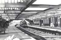 A bright and sunny July day at Troon in 1959 as Fairburn 2-6-4T 42059 runs into the station from the north with a Glasgow - Girvan train.   <br><br>[G H Robin collection by courtesy of the Mitchell Library, Glasgow 04/07/1959]