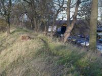 In 1846/7 a number of short curves and connections were made by the North British Railway to the re-gauged Edinburgh and Dalkeith Railway. This view shows the NBR curve which connected the Edinburgh and Dalkeith Railway's Leith branch to the NBR at Craigentinny - a west to south curve. This was to be the NBR's only connection to the Leith branch until 1852 when the a new line on a sweeping curve connected to the branch to the north of today's Baileyfield depot. The alignment of the E&DR was lower, to the right and parallel to Baileyfield road. This view looks north with the ECML bridge over Baileyfield Road, under which the E&DR also passed a little to the left. Behind the camera was the junction and the site of the first Portobello halt.<br><br>[Bill Roberton 24/11/2015]