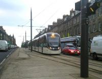 A tram from the Airport reaches journey's end on 25/11/2015. Note the stub on the westbound line, future-ready for expansion Leithwards, if and when that goes ahead. Note also that the never-changing (for now) signal is designated 'PPL' for the adjacent Picardy Place. This is where the stop was to be in the original plan.<br><br>[David Panton 25/11/2015]