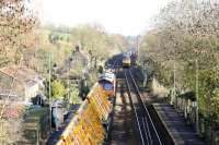 66129 with a PW train southbound, probably for Westbury yard or the PW Depot near Taunton, passing an unknown WCRC 47. The sun came out in the wrong direction. There are times, it can be a nuisance.<br><br>[Peter Todd 26/11/2015]