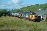 37405 'Strathclyde Region' takes 3442 'The Great Marquess' south at the end of season in 1989 past the site of Whistlefield station.<br><br>[Ewan Crawford //1989]