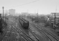Looking east over a wet former Great Southern's East Wall Yard, Dublin, with a variety of traffic being handled.<br><br>[Bill Roberton /06/1993]