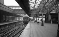 Looking north along Platform 6 North at Aberdeen in May 1973 with an Inverness service waiting for the last passengers. A single railcar has been added to the rear of the usual Class 120 Swindon set.<br><br>[John McIntyre 26/05/1973]