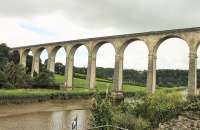 Calstock viaduct, striding across the River Tamar, which is 120' below and still tidal at this point. The viaduct is Grade II listed and a Transport Trust <I>Transport Heritage Site</I> being the largest viaduct in Britain constructed entirely of concrete blocks. [See image 52522] <br><br>[Mark Bartlett 29/07/2015]