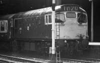 An E&G push pull service takes water at Glasgow Queen Street in March 1974. 27207 has had a hose connected during the layover between runs.<br><br>[John McIntyre /03/1974]
