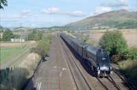 60009 'Union of South Africa' (during the 'Osprey' period) passes Auchterarder with the southbound 'Elizabethan' special in 1990. The box was switched out. This photograph was taken to compare with R Hobbs photograph in 'Scottish Steam in Colour' page 47. <br><br>[Ewan Crawford //1990]