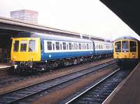 A pair of DMU's at Reading station on the afternoon of 10 February 1983. The train on the right looks to be a special.<br><br>[Peter Todd 10/02/1983]