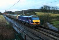 <I>Christmas Post Special</I>. As in 2014 additional mail trains ran between Sheildmuir and Warrington in December 2015. Scotrail liveried 90024 is seen taking a rake of vans south crossing a swollen Grizedale Beck at Woodacre.<br><br>[Mark Bartlett 11/12/2015]