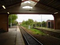 Looking out in a northerly direction from within the magnificent wooden train shed at Frome in May 2015 [see image 52435]. An HST stop board stands directly opposite the signal up ahead, for those GWR South West services running via Westbury and Taunton that are routed off the through line to call at the station.<br><br>[David Pesterfield 08/05/2015]