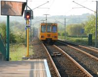 With the last traces of morning mist hanging over the Ouseburn Valley, a city-bound Tyne and Wear Metro service leaves Callerton Parkway on 10 May 2006 . Unit 4051 is on the downhill run towards its next stop at Bank Foot with  a Newcastle Airport - Park Lane working.<br><br>[John Furnevel 10/05/2006]