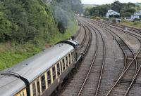 A service for Kingswear heads south from Paignton behind GWR 2-8-0T 5239 passing Goodrington carriage sidings, which are still used by some FGW & Cross-Country trains that have terminated at Paignton. Goodrington Sands station is just visible in the distance.<br><br>[Mark Bartlett 28/07/2015]