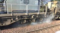 Spraying in action as MPVs DR98955 and DR98905 work 3S90 on RHtt duties from Girvan to Mossend through Barassie station.<br><br>[Ken Browne 12/09/2015]