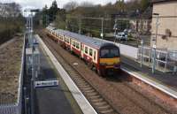 320310 is seen passing Bowling with a Glasgow bound service on 27 April 2013.<br><br>[John McIntyre 27/04/2013]