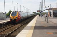 A pair of Virgin Voyagers passing Buckshaw Parkway heading west to rejoin the WCML at Euxton Jct on 14 July 2013. The train was diverted via Manchester whilst engineering work took place on the WCML during a 9 day closure.<br><br>[John McIntyre 14/07/2013]