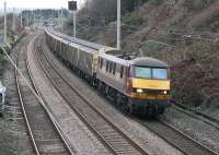 90039, in faded EWS livery, heads the Christmas extra postal south through Hest bank on 211215. This year these trains have made daily return trips between the Sheildmuir and Warrington mail terminals on December weekdays.  <br><br>[Mark Bartlett 21/12/2015]