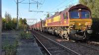 DBS Class 66 No. 66060 works 4J08 Longannet - Hunterston empty hoppers through Coatbridge Central station on 29th September 2015.<br><br>[Ken Browne 29/09/2015]