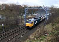 An unidentified  electric multiple unit, sandwiched between two translator coaches, is hauled by 47805 up the gradient towards  Eastfield on 23rd December 2015.<br><br>[Colin McDonald 23/12/2015]