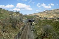 The south portal of Blea Moor / Bleamoor Tunnel (take your pick), seen from the unusual combined aqueduct and farm accommodation bridge which also carries the right of way between Ribblehead and Dent village over the S&C. The Blea Moor Up distant can be seen in in the foreground. [Editor's note: Bill raises a good question - we use Blea Moor since many sources use this.]<br><br>[Bill Jamieson 23/04/2015]