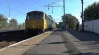 Freightliner class 86s No 86638+86605 on a Mossend to Coatbridge FLT light engine move through Coatbridge Central on 29 September 2015. The pair will return south with the 4M11 Coatbridge - Crewe Basford Hall containers.<br><br>[Ken Browne 29/09/2015]