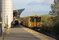 507007, working a service from Ormskirk, terminates at the much rebuilt Sandhills station due to a track defect at its Liverpool Central destination. Passengers seen here joined a very full train coming in from Southport while the empty EMU used the reversing siding [See image 53343] and then formed a service back to Ormskirk.<br><br>[Mark Bartlett 16/11/2015]