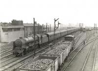 Royal Scot 46104 <I>Scottish Borderer</I> runs past Polmadie shed on 14 May 1960 at the head of a Liverpool / Manchester - Glasgow Central train. <br><br>[G H Robin collection by courtesy of the Mitchell Library, Glasgow 14/05/1960]