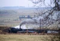 NCB No. 1 (Andrew Barclay 2368 of 1955) builds up a head of steam at Cronberry exchange sidings on the old Gasswater branch with empty coal wagons for Cairnhill Mine. The BR/NCB interchange was 1/4 mile east of Cronberry Station and would have been controlled from Cronberry Junction 'box (closed 1966). Prior to that access was controlled by Gass Water Branch Junction signalbox (opened 1881, closed 1906). Before the mainline was doubled access was via two reversals which must have been to protect the mainline from the steeply graded branch.<br><br>[Bill Roberton //1974]