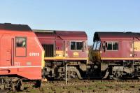 DBS liveried 67018 <I>Keith Heller</I> is seen out of use in the station sidings at Didcot just before the Christmas shutdown of the network. Stabled alongside the Class 67 are two EWS liveried 66s, Nos. 66116 and 66126.<br><br>[Peter Todd 28/12/2015]