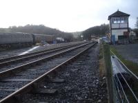 View west through Bolton Abbey station showing the front wall in place for a second platform. Brush type 4 D1524 is stored in the sidings to the left. The signal box nearest is the former Sleights East Siding Box from Pinxton, Derbyshire, which is to be used as a demonstration box. At the far end of the station is the former Guiseley Station signal box, which required a narrower lower section in order to enable it to fit between running lines and sidings at the north end of that station.<br><br>[David Pesterfield 21/12/2015]