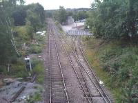 Looking along a virtually weed free remaining section of the Railway Street & Wharf Street branch line towards the main line junction with the former L&Y cross pennine route at Thornhill Lees, Dewsbury. This is the stabling and run round loop to service the Hope Cement distribution depot whose sidings are seen running off to the right.<br><br>[David Pesterfield 03/09/2015]