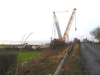 A view across the work site for the bridge replacement on Warehill Lane, south east of Tollerton on 29 December. The large Ainscough crane used to remove the old bridge structure and install its replacement over the four track East Coast Main Line.<br><br>[David Pesterfield 29/12/2015]