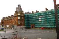 Barriers and scaffolding around Ayr's Station Hotel in January 2016. Built by the GSWR in 1866, the grade 2 listed building, which forms an integral part of Ayr station, closed in 2013, since when it has begun to show considerable signs of neglect. The current activity is the result of a dangerous buildings notice served on the current owners by South Ayrshire Council.<br><br>[Colin Miller 05/01/2016]