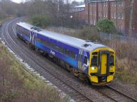 158701 passes the closed Duddingston and Craigmillar Station with a presumed empty stock working to Haymarket Depot (didn't show up onrealtimetrains ...) and passes former rail-served breweries.<br><br>[Bill Roberton
 05/01/2016]