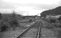 View south at Aviemore on the Grantown line in June 1973. The PW gang is removing the ballast around the sleepers in preparation for the installation of a set of points, one of the first activities at Aviemore by the Strathspey Railway. The main line and Aviemore SB can be seen in the right background.<br><br>[John McIntyre /06/1973]