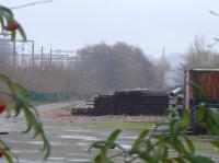 The storage yard on the south side of the E and G near the Balgreen Road tram stop contains rails and poles for the next phase of construction.<br><br>[Bill Roberton
 05/01/2016]