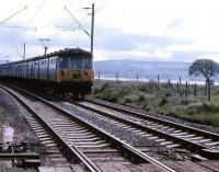 A pair of AM3 EMUs approaching Ardmore East level crossing with a service to Helensburgh Central in the late 1960s or early 1970s.<br><br>[John McIntyre //]