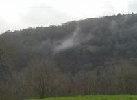 On a damp morning the cold air from the abandoned tunnel leading to Lydbrook Junction condenses into a cloud. The tunnel portal is below left of the cloud, behind the trees. The earthworks right of the cloud are the remains of lime kilns on Coppett Hill.<br><br>
<br><br>
Note from S. Neave: The air in Lydbrook tunnel is warmer, not colder. That's why it's water vapour condenses in the colder outside temp (like a steam engine).<br><br>[John Thorn 05/01/2016]