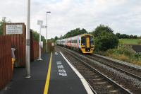 FGW 158798, on a Warminster to Westbury working, slows for the stop at Dilton Marsh Halt. The platforms here are staggered either side of the road bridge and this view, taken from the bottom of the ramp, illustrates just how short they are. [See image 52174]<br><br>[Mark Bartlett 25/07/2015]