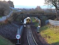 Signs of an overnight frost are still present as the 0959 ex-Tweedbank boards at Newtongrange on a cold January morning in 2016. Photographed looking south from Dean Park footbridge through the site of the original 1908 station.<br><br>[John Furnevel 11/01/2016]