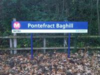 View of the up side running in board at Pontefract Baghill Station, which is replicated over the entrance to the tunnel through the main building providing access to the platforms.<br><br>[David Pesterfield 13/11/2015]