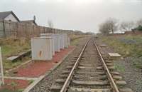 View west from the level crossing at Gatehead showing the disused westbound platform to the left.<br><br>[Ewan Crawford //1997]