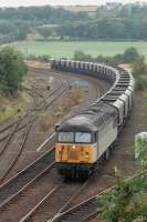 56081 nears Inverkeithing Central Junction with empty hoppers from Longannet Power Station in September 1996.<br><br>[Bill Roberton
 /09/1996]