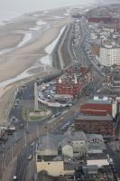 A <I>Flexity</I> tram approaches the North Pier stop in Blackpool as it runs south behind the Metropole Hotel. Beyond the Metropole the collonades of the Middle Walk can be seen below the tram tracks. [See image 43082] for a ground level view of the same location.  <br><br>[Mark Bartlett 16/01/2016]