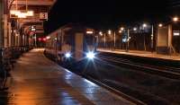 ScotRail Sprinters 156457+156513 working 2A22 the last train of the day to Dumfries on 16 January 2016, seen here about to leave Kilmarnock.<br><br>[Ken Browne 16/01/2016]